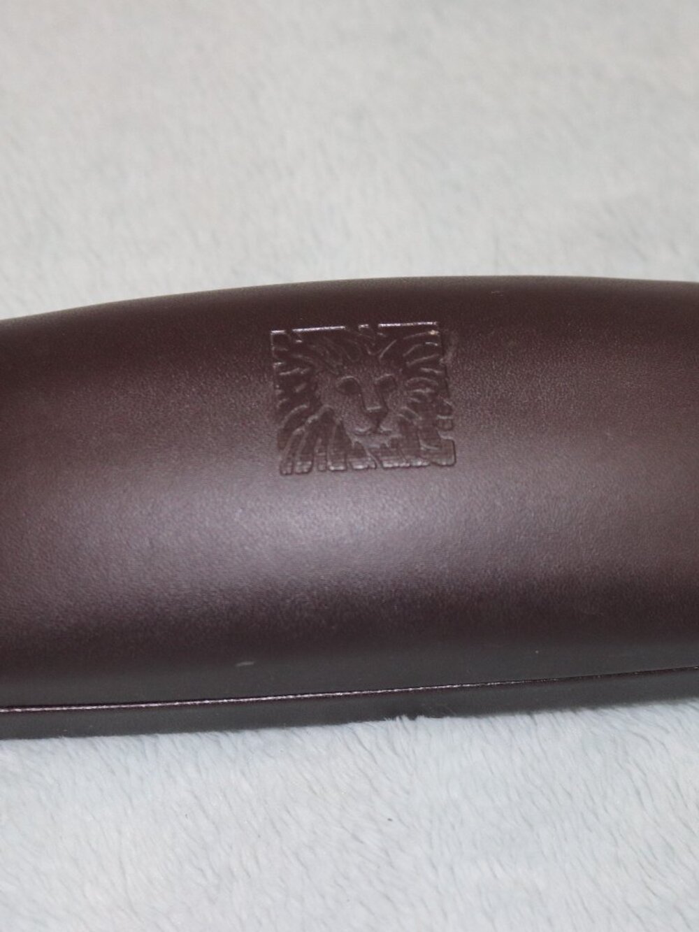 Women's Anne Klein burgundy eyeglass case.